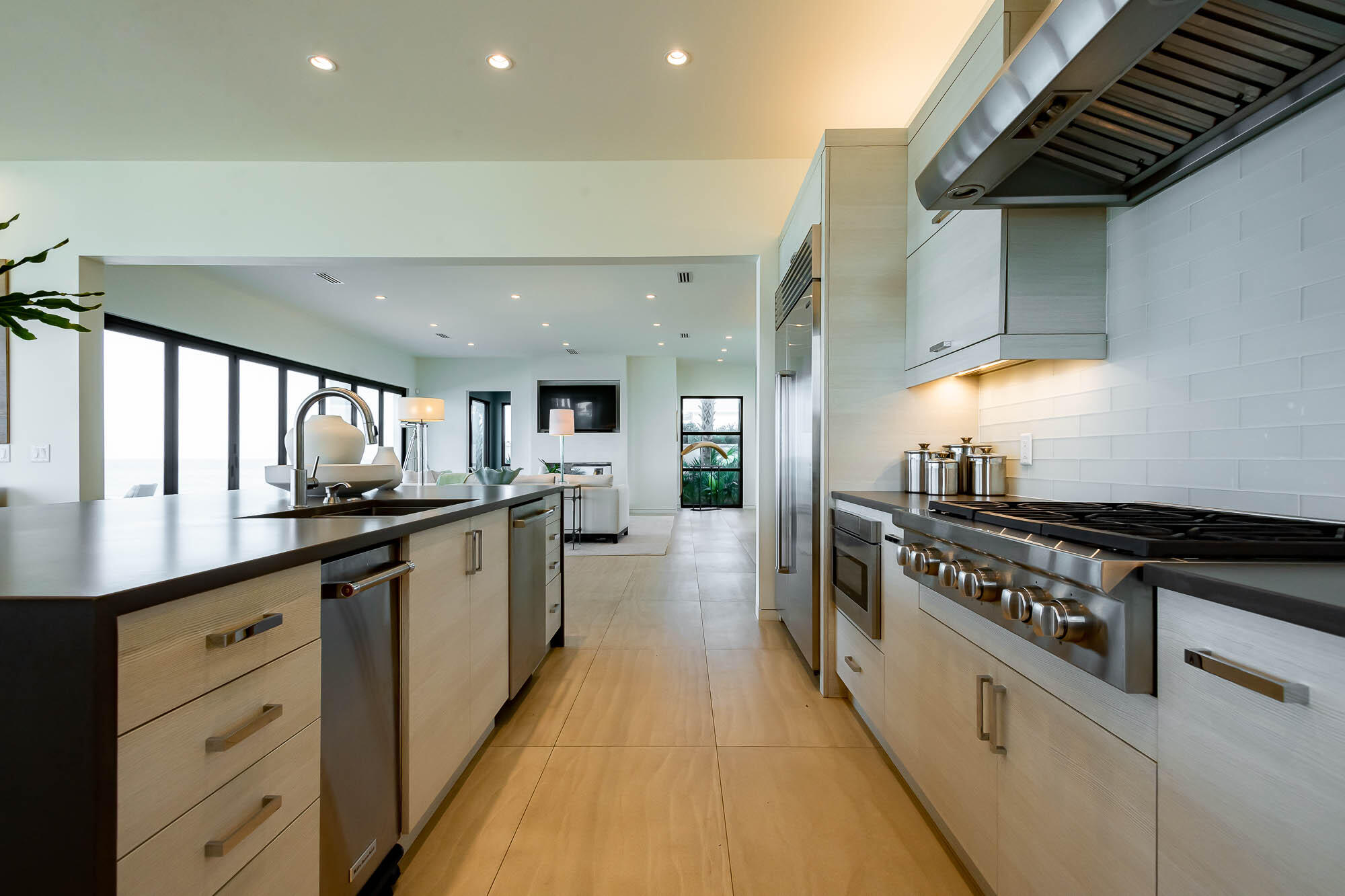 59 Pelican Circle Seacrest, FL 32461 - Photo 33 of 122 a large kitchen with stainless steel appliances granite countertop a lot of counter space and a sink