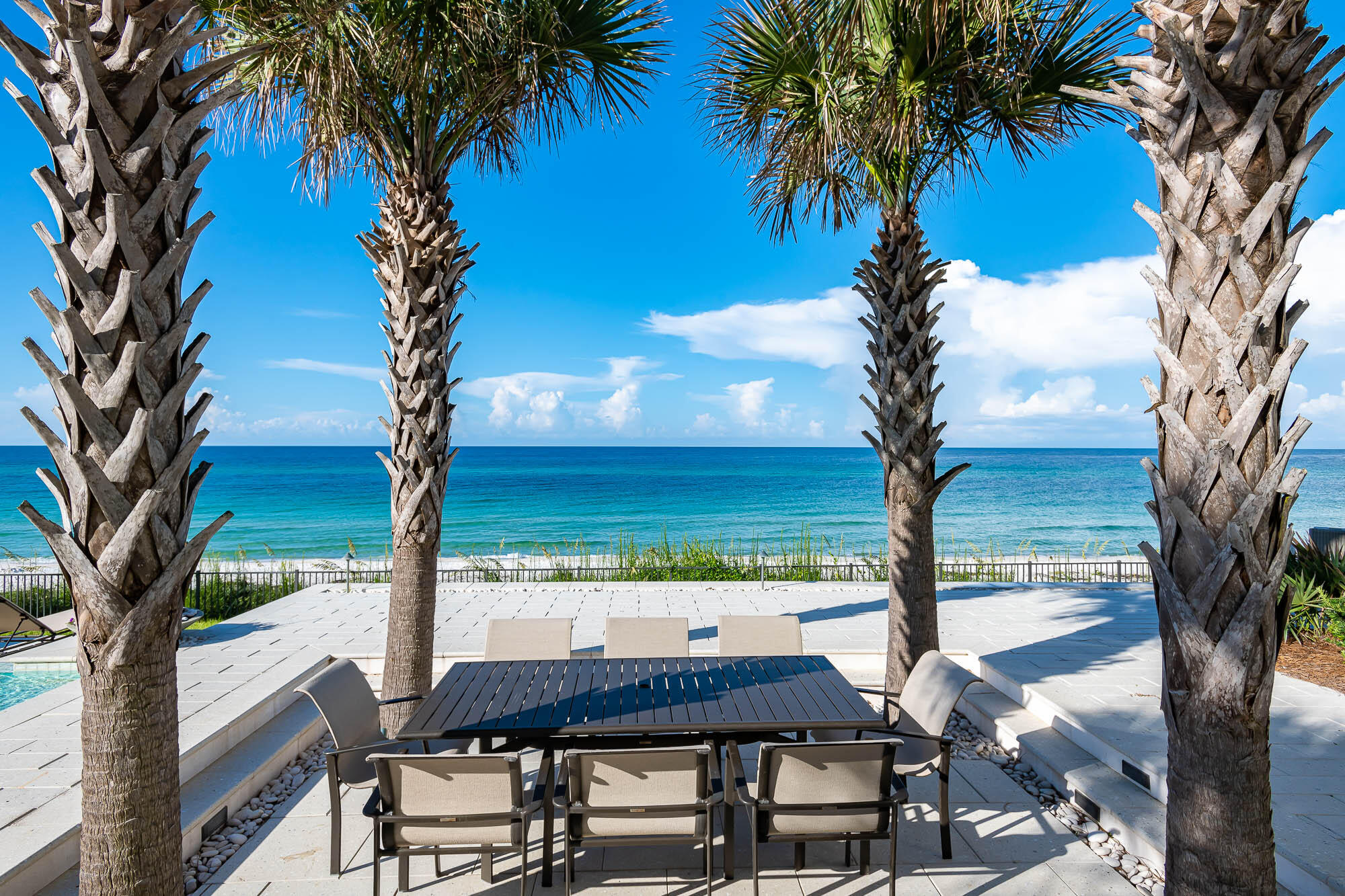59 Pelican Circle Seacrest, FL 32461 - Photo 44 of 122 a view of a table and chairs in the patio