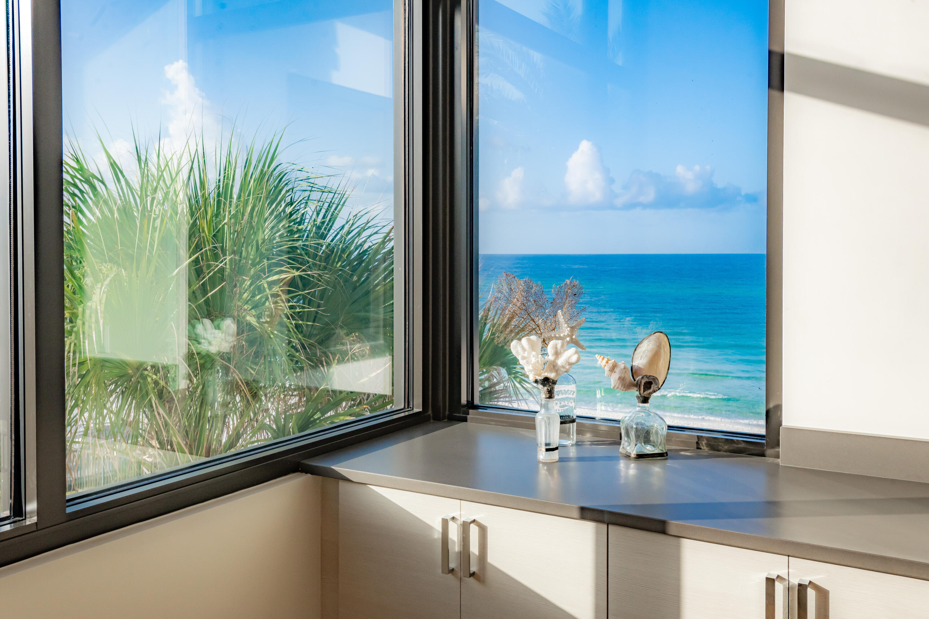 59 Pelican Circle Seacrest, FL 32461 - Photo 69 of 122 a view of a living room with a floor to ceiling window and kitchen view