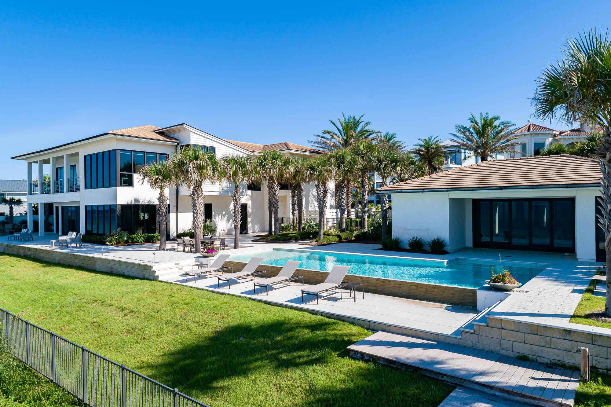 59 Pelican Circle Seacrest, FL 32461 - Photo 7 of 122 a view of a house with swimming pool and sitting area