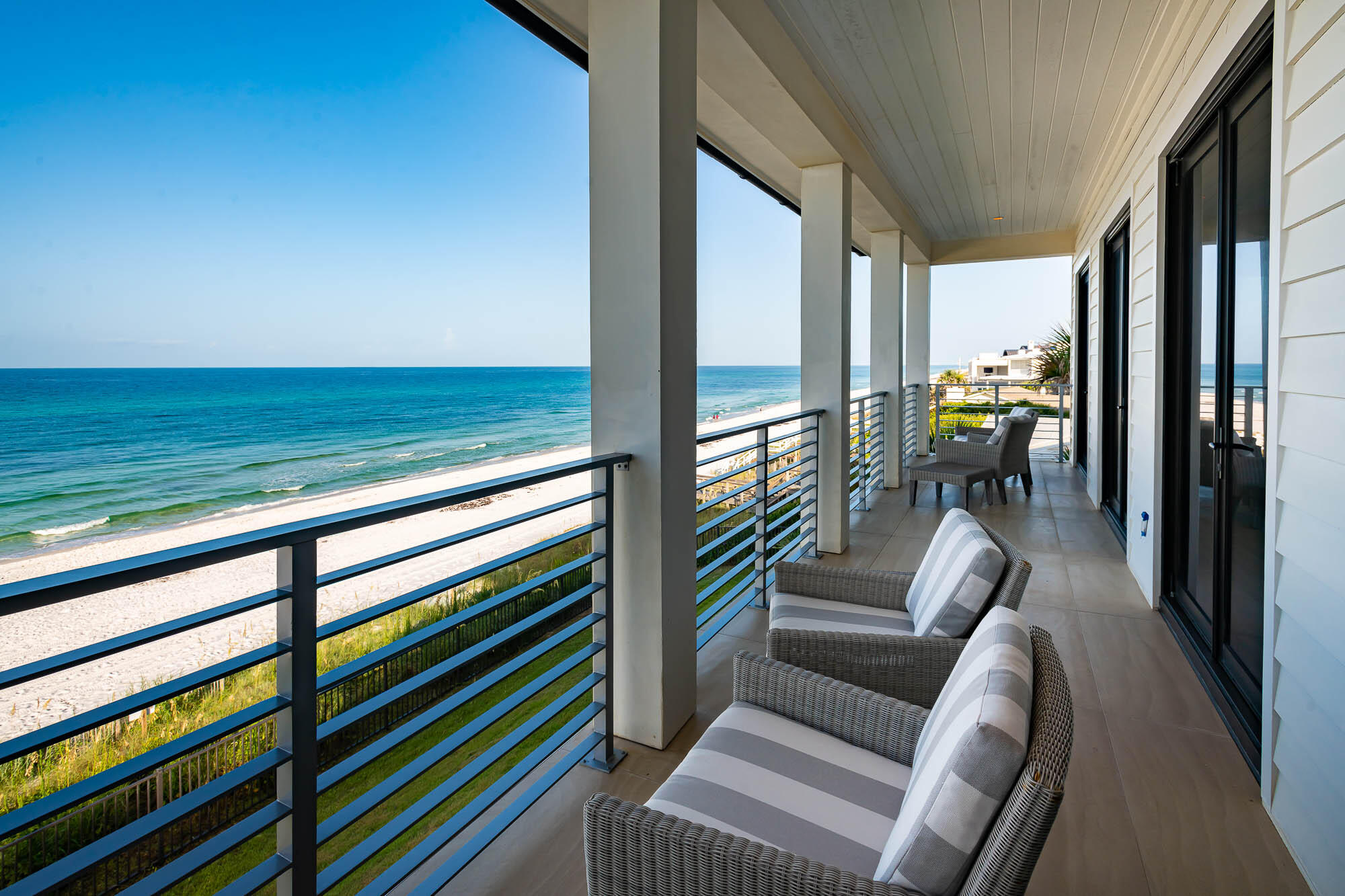 59 Pelican Circle Seacrest, FL 32461 - Photo 86 of 122 a living room with furniture and a floor to ceiling window