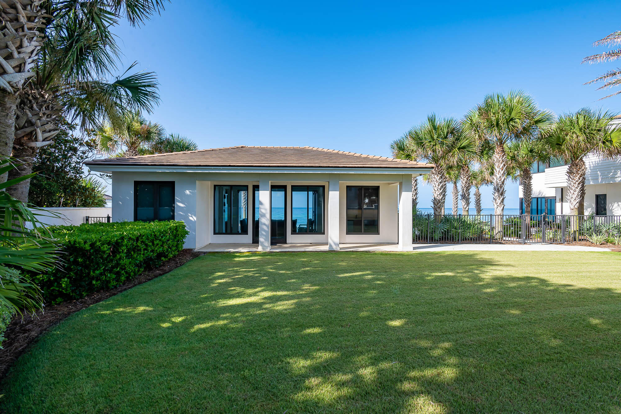 59 Pelican Circle Seacrest, FL 32461 - Photo 91 of 122 a front view of a house with a garden