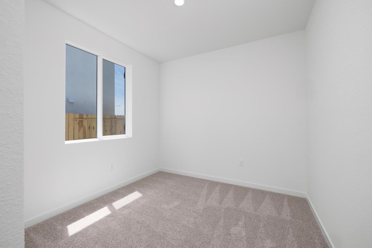 829 Chatham Lane Patterson, CA 95363 - Photo 13 of 16 a view of an empty room with a window