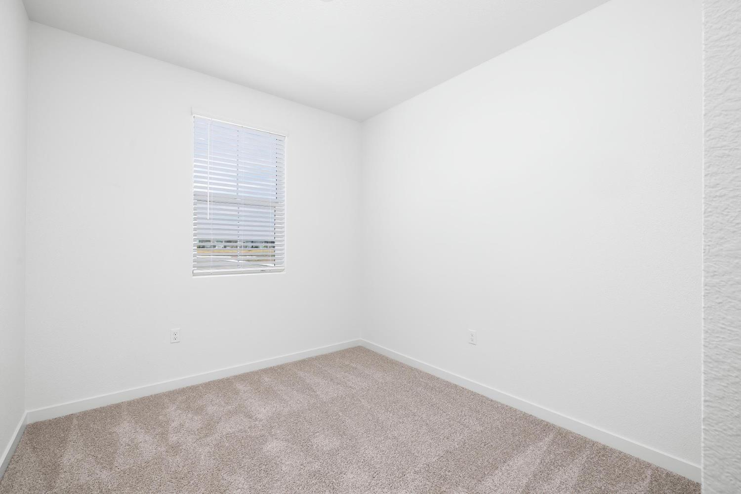 829 Chatham Lane Patterson, CA 95363 - Photo 14 of 16 an empty room with a window