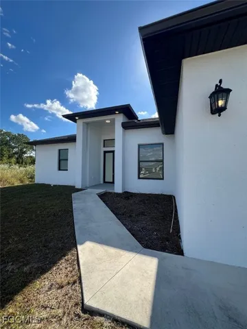 a living room with a couch and a fireplace