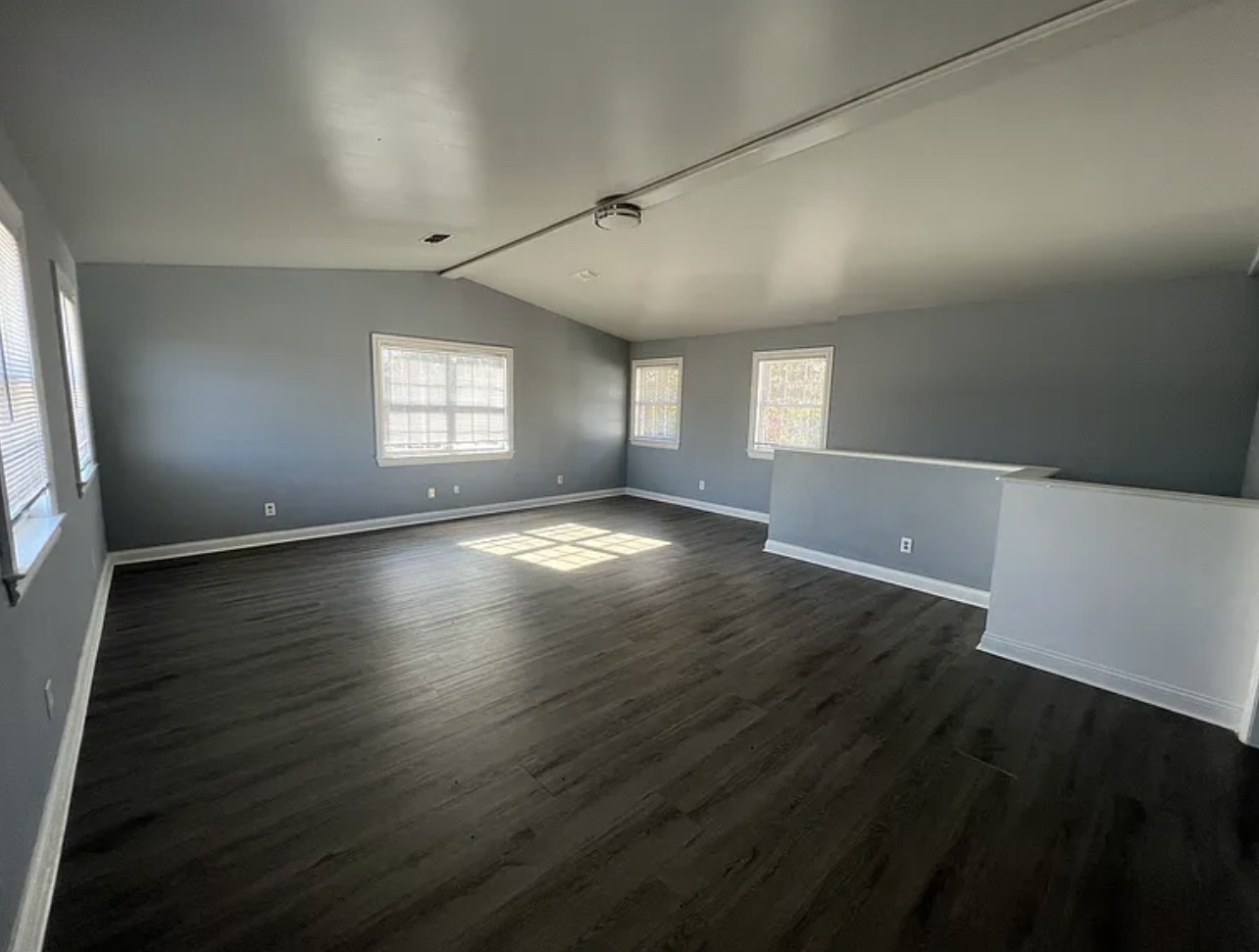 5465 Burnt Knob Road Murfreesboro, TN 37129 - Photo 12 of 14 an empty room with wooden floor and windows