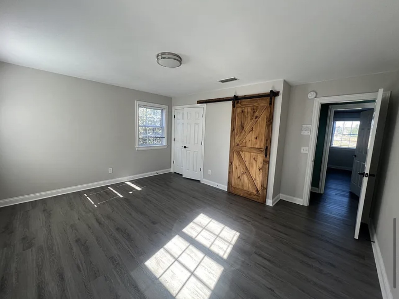 5465 Burnt Knob Road Murfreesboro, TN 37129 - Photo 8 of 14 an empty room with wooden floor and windows