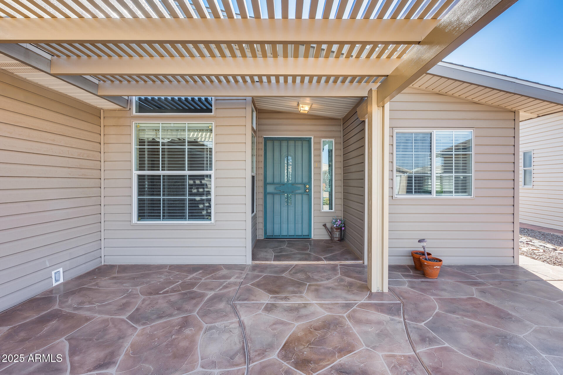 3301 South Goldfield Road, Unit 1043 Apache Junction, AZ 85119 - Photo 10 of 36 a view of a house with door and wooden walls