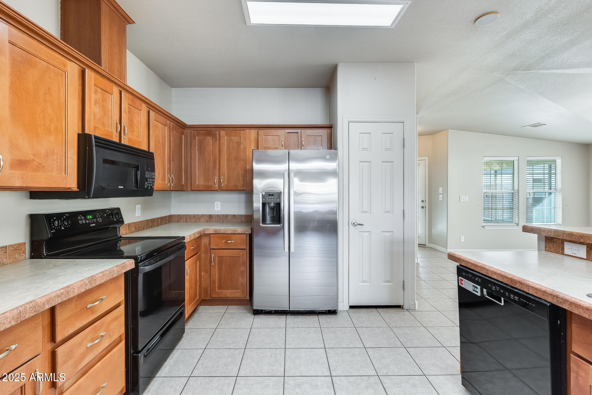 3301 South Goldfield Road, Unit 1043 Apache Junction, AZ 85119 - Photo 2 of 36 a kitchen with stainless steel appliances granite countertop a refrigerator stove and sink