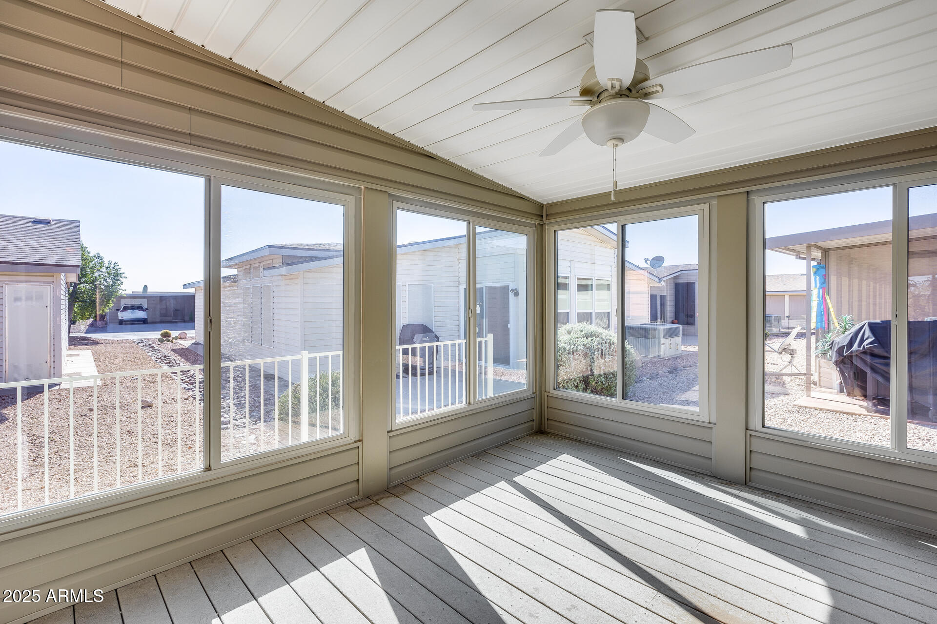 3301 South Goldfield Road, Unit 1043 Apache Junction, AZ 85119 - Photo 5 of 36 a view of a balcony with wooden floor