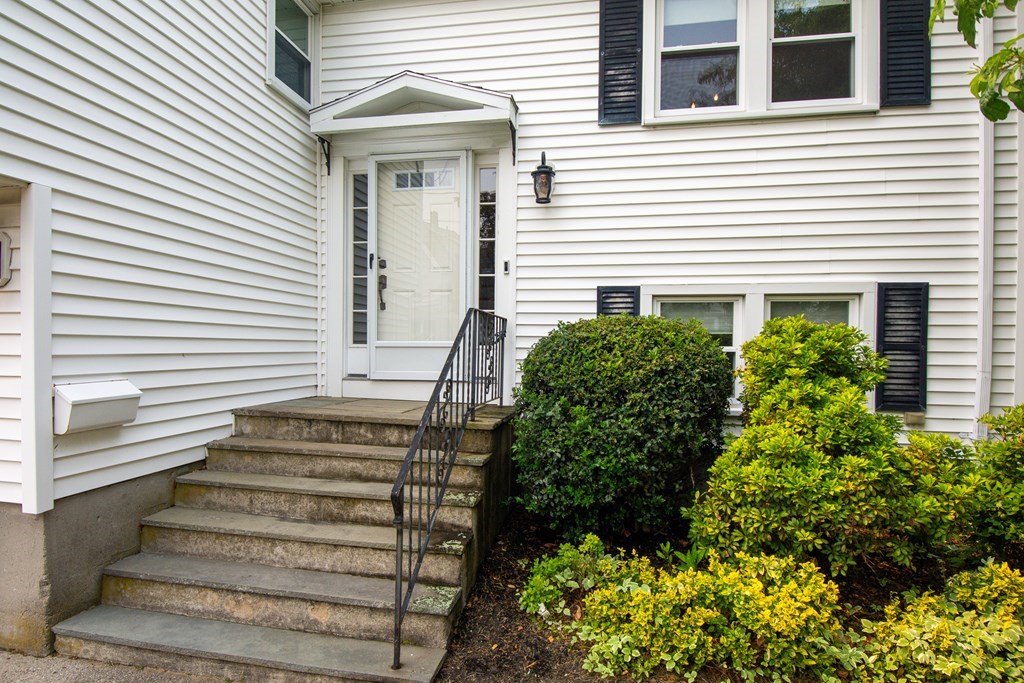 17 Mark Lee Road Needham, MA 02494 - Photo 3 of 24 a front view of a house with a garden
