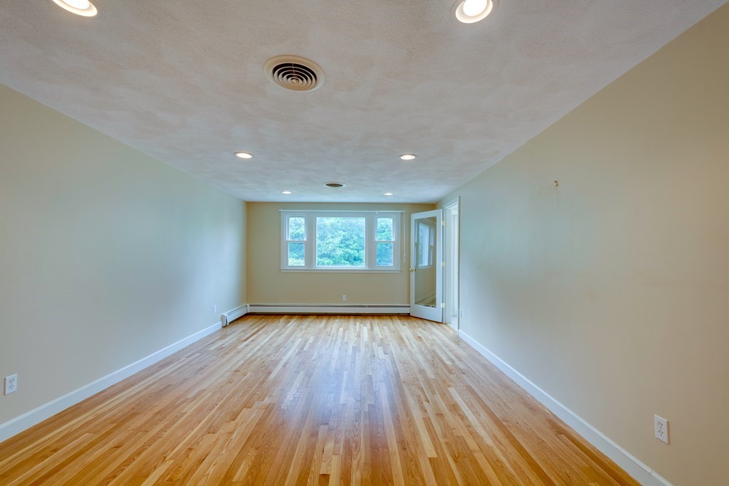 17 Mark Lee Road Needham, MA 02494 - Photo 6 of 24 wooden floor in an empty room with a window