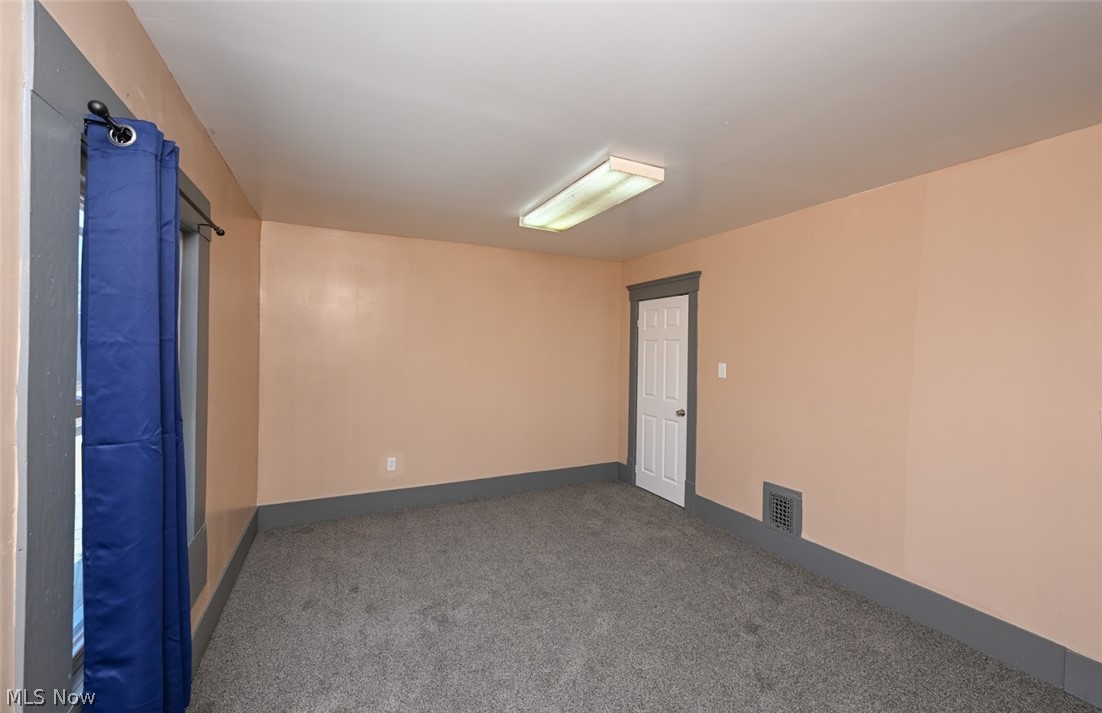 868 North Main Street Akron, OH 44310 - Photo 18 of 30 Spare room featuring carpet floors and baseboards