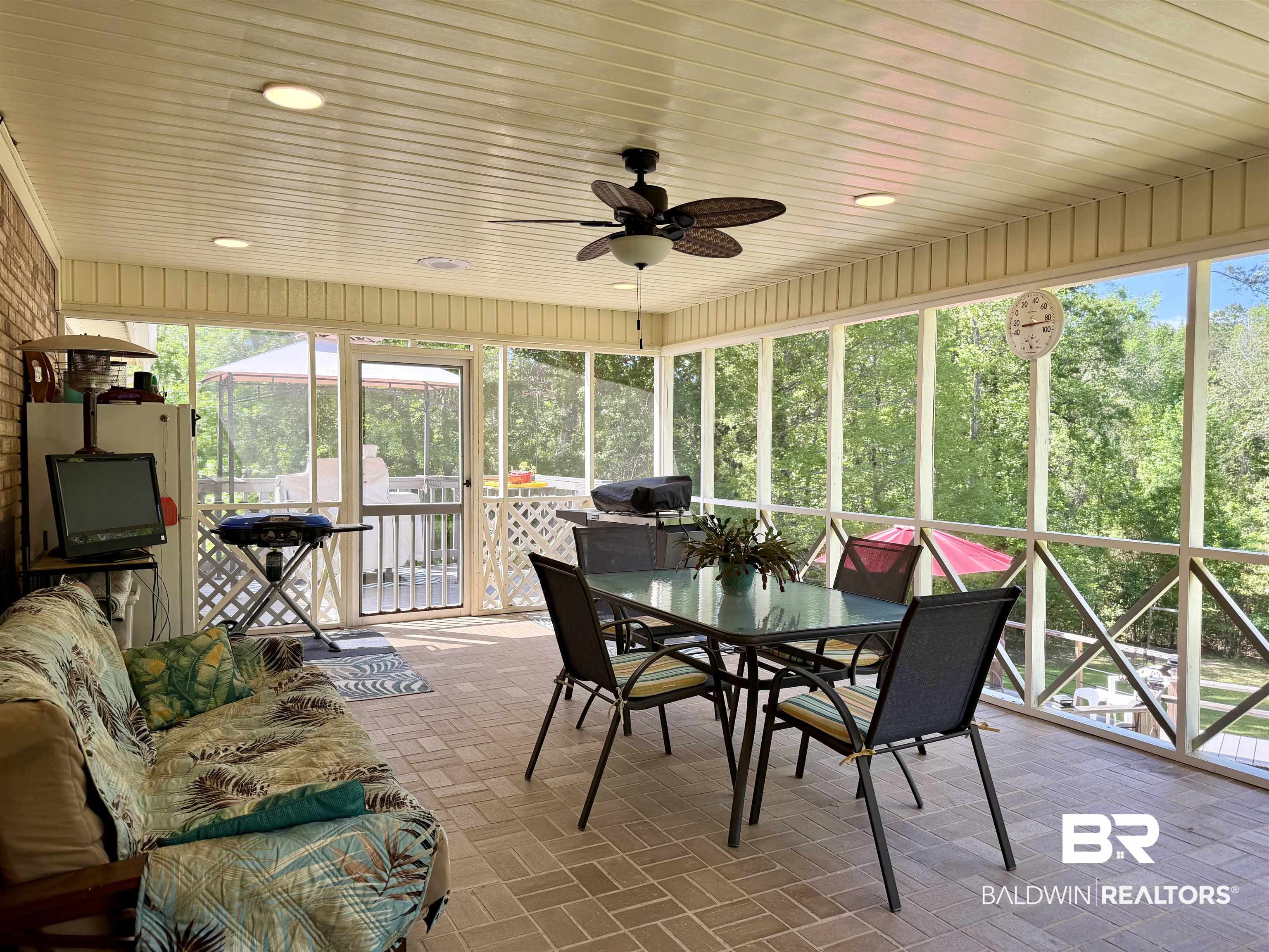 2944 Appleton Road Brewton, AL 36426 - Photo 33 of 65 Sunroom / solarium with a ceiling fan and outdoor dining area