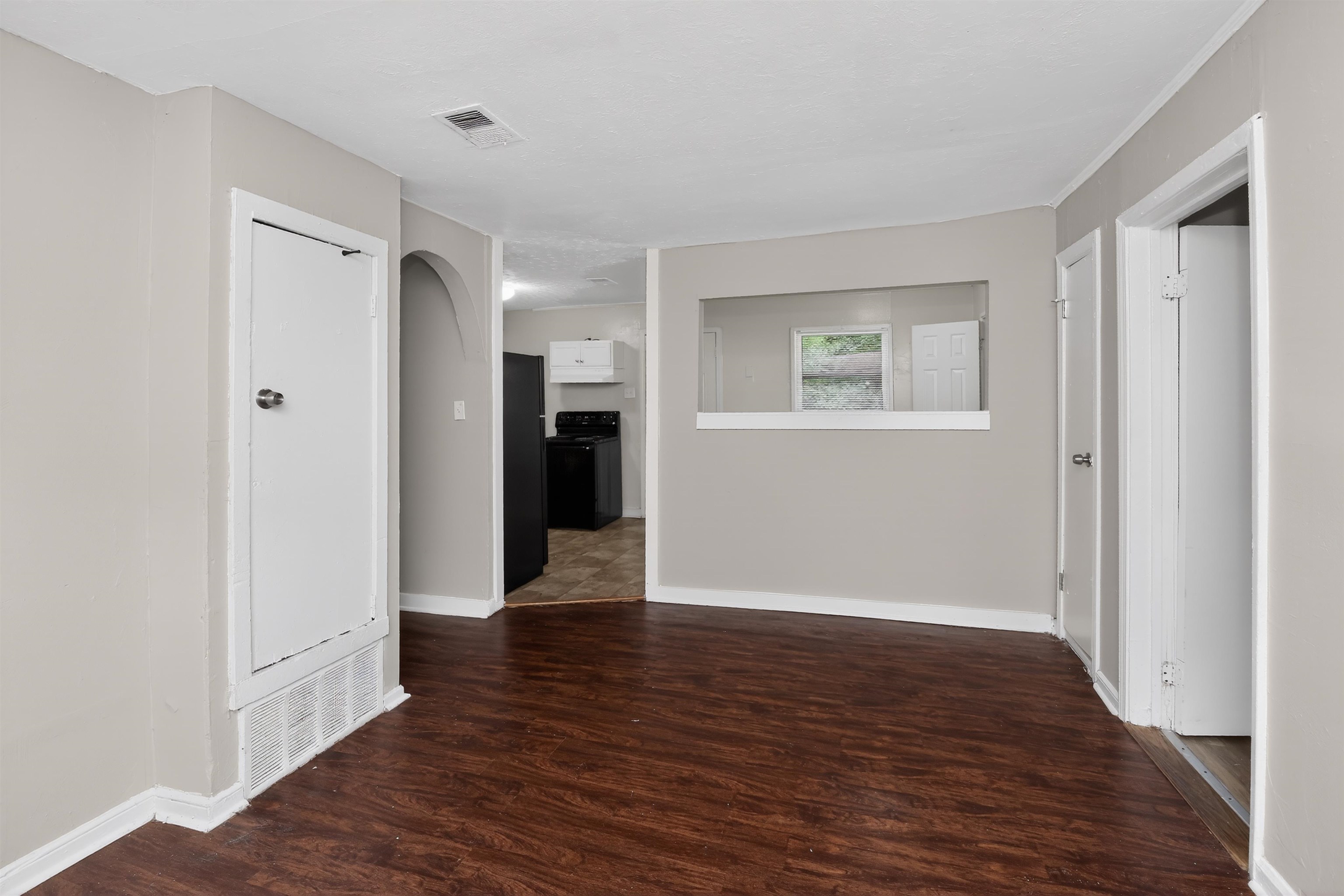 4838 Manson Road Memphis, TN 38109 - Photo 15 of 28 Interior space featuring wood-finish flooring, light neutral wall paint, and white trim