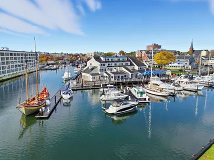 a view of a lake with boats and trees