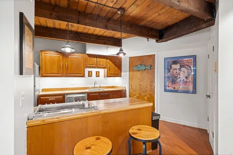 a bathroom with a toilet a sink and a mirror