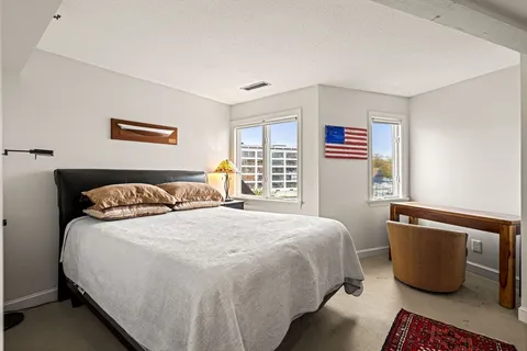 a bedroom with bed and window