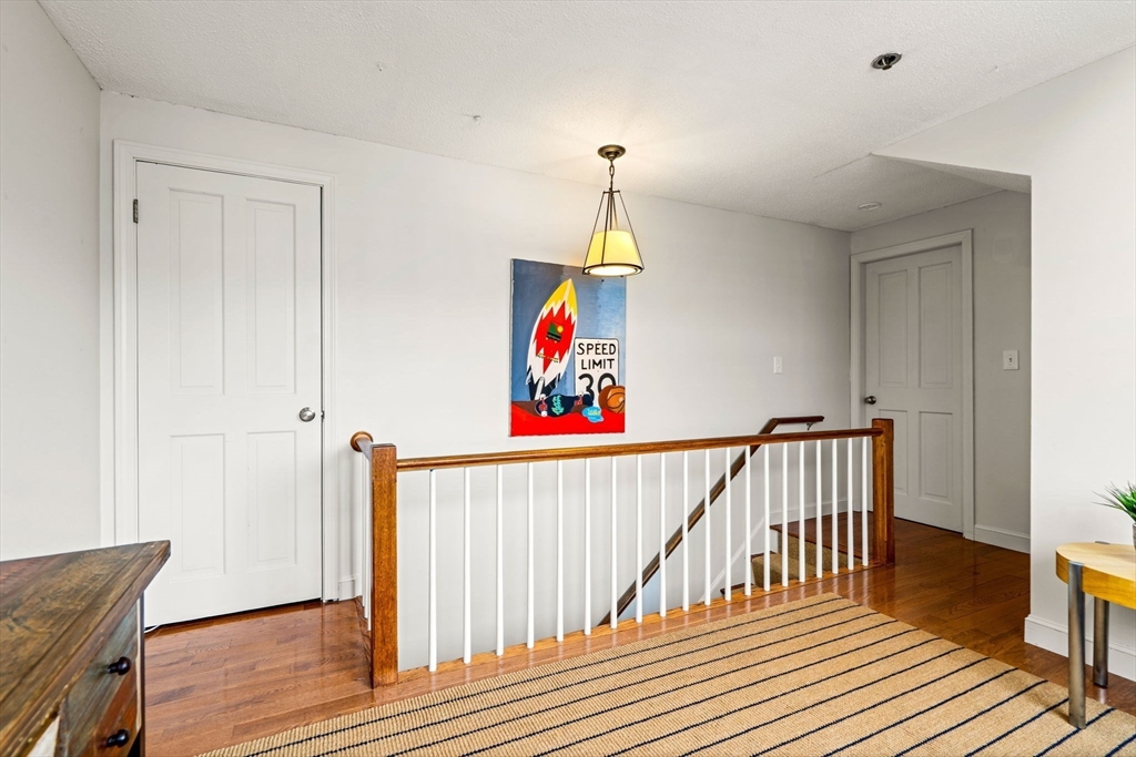 90 Wharf Street, Unit L10 Salem, MA 01970 - Photo 28 of 32 a view of hallway with wooden floor and stairs