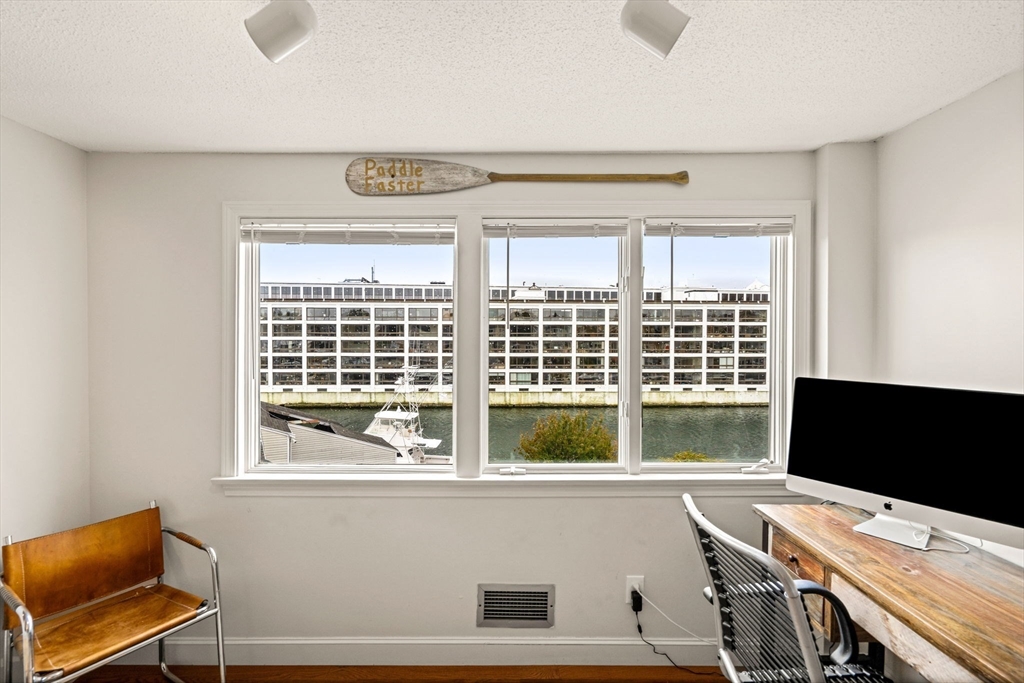 90 Wharf Street, Unit L10 Salem, MA 01970 - Photo 30 of 32 a view of a workspace with furniture and a window