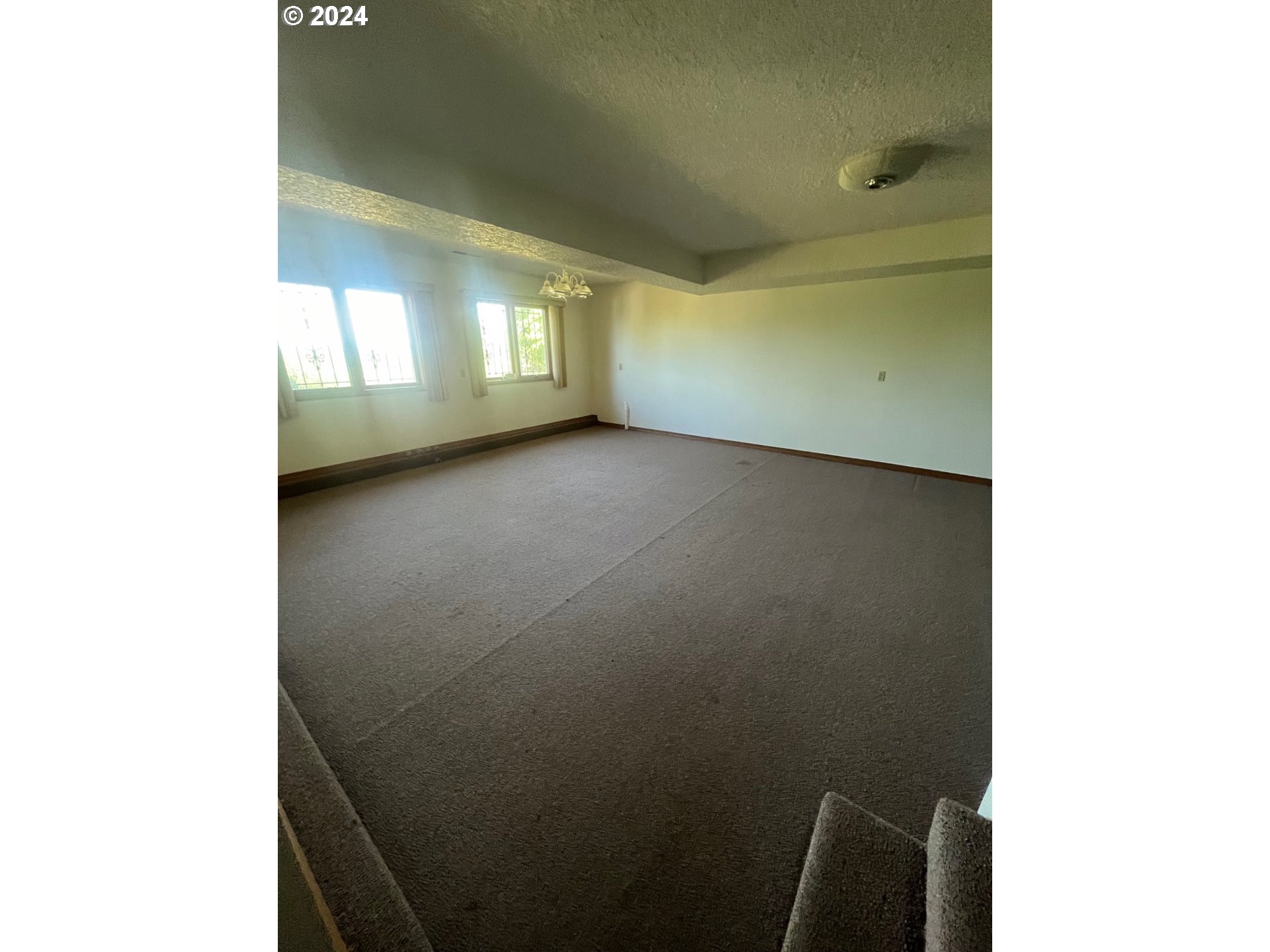 10755 Southeast 92nd Avenue Happy Valley, OR 97086 - Photo 13 of 40 a view of an empty room with a window