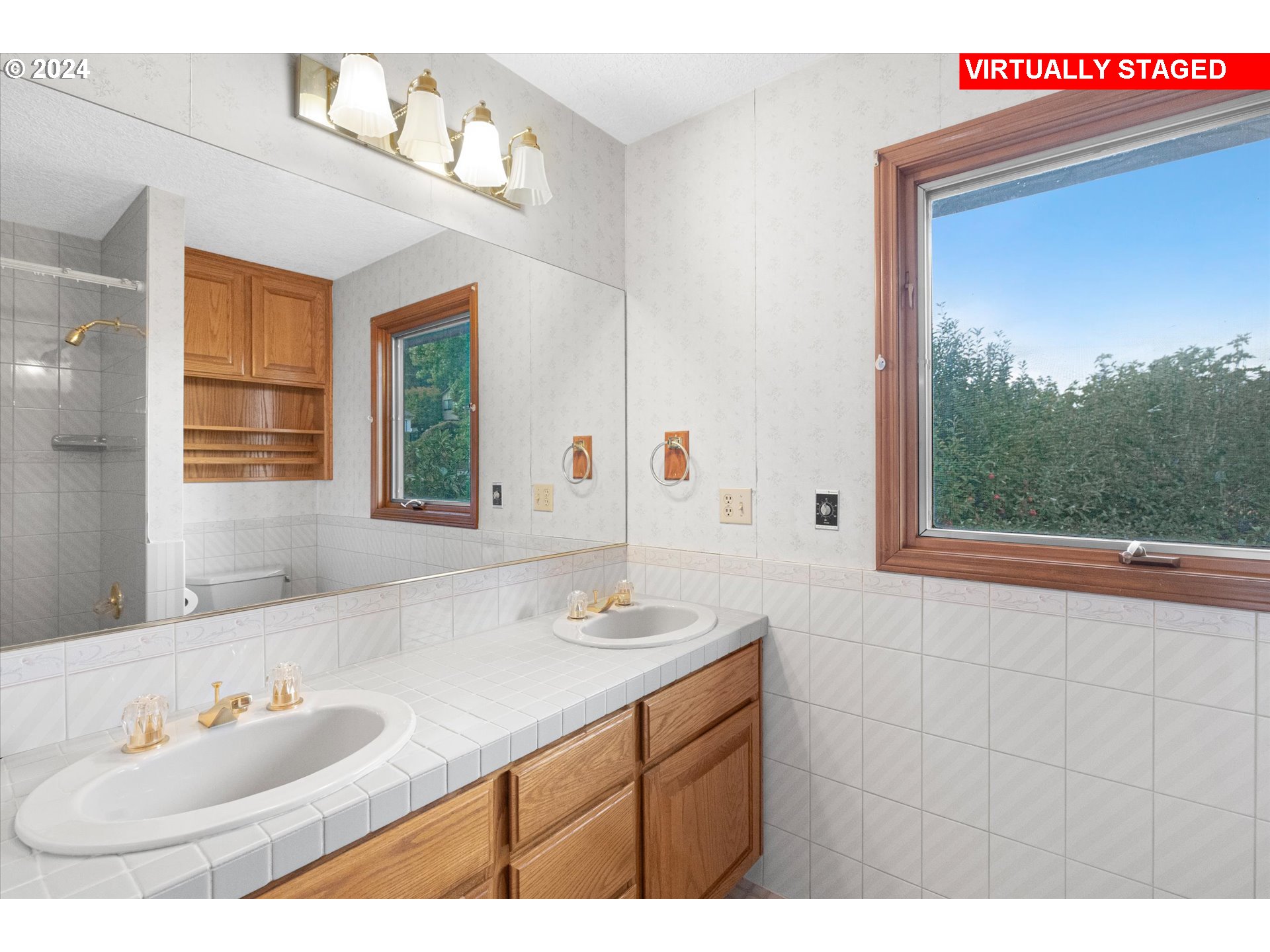 10755 Southeast 92nd Avenue Happy Valley, OR 97086 - Photo 22 of 40 a bathroom with a sink vanity and a mirror