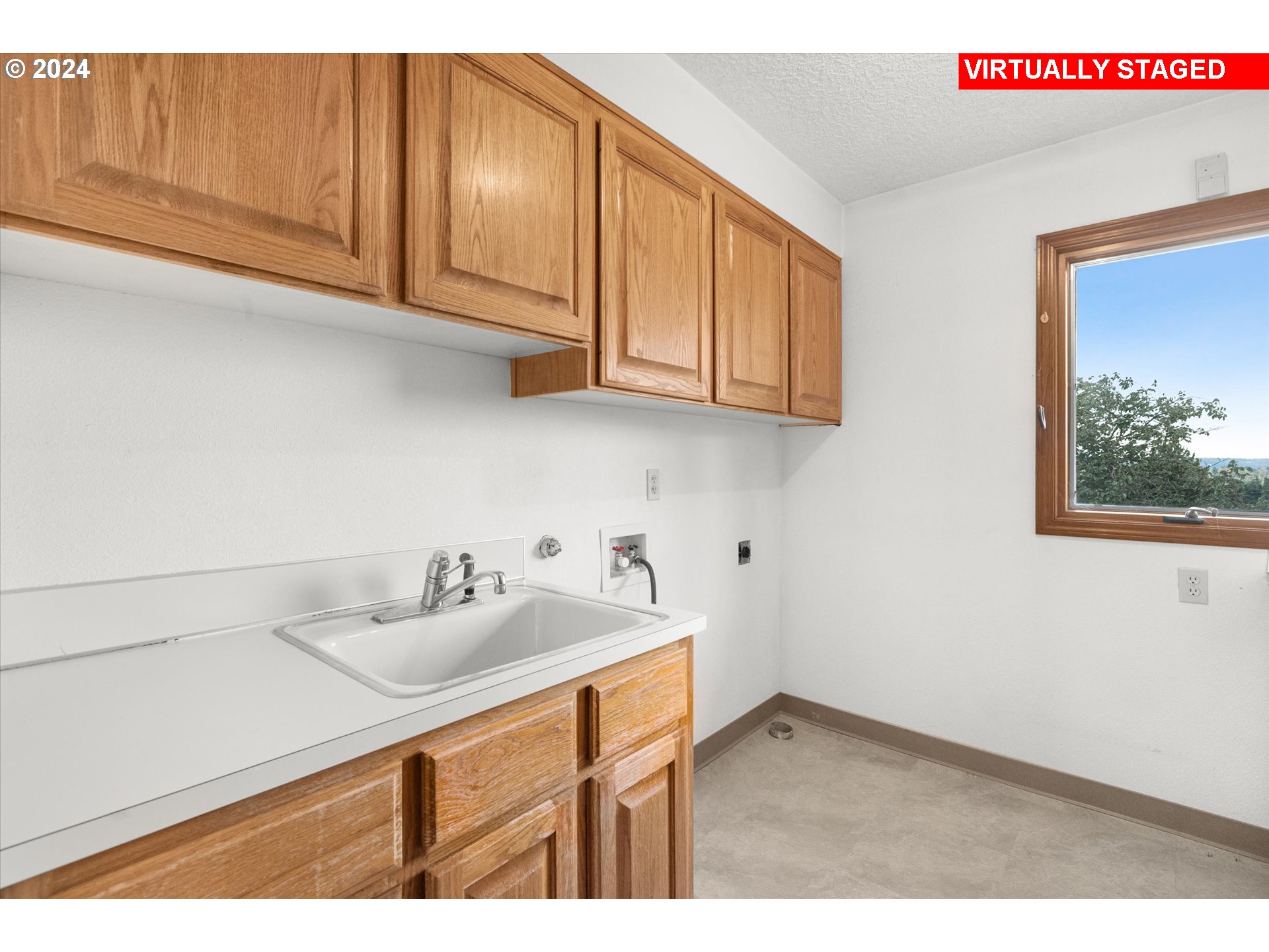 10755 Southeast 92nd Avenue Happy Valley, OR 97086 - Photo 23 of 40 a kitchen with stainless steel appliances granite countertop a sink dishwasher and cabinets with wooden floor