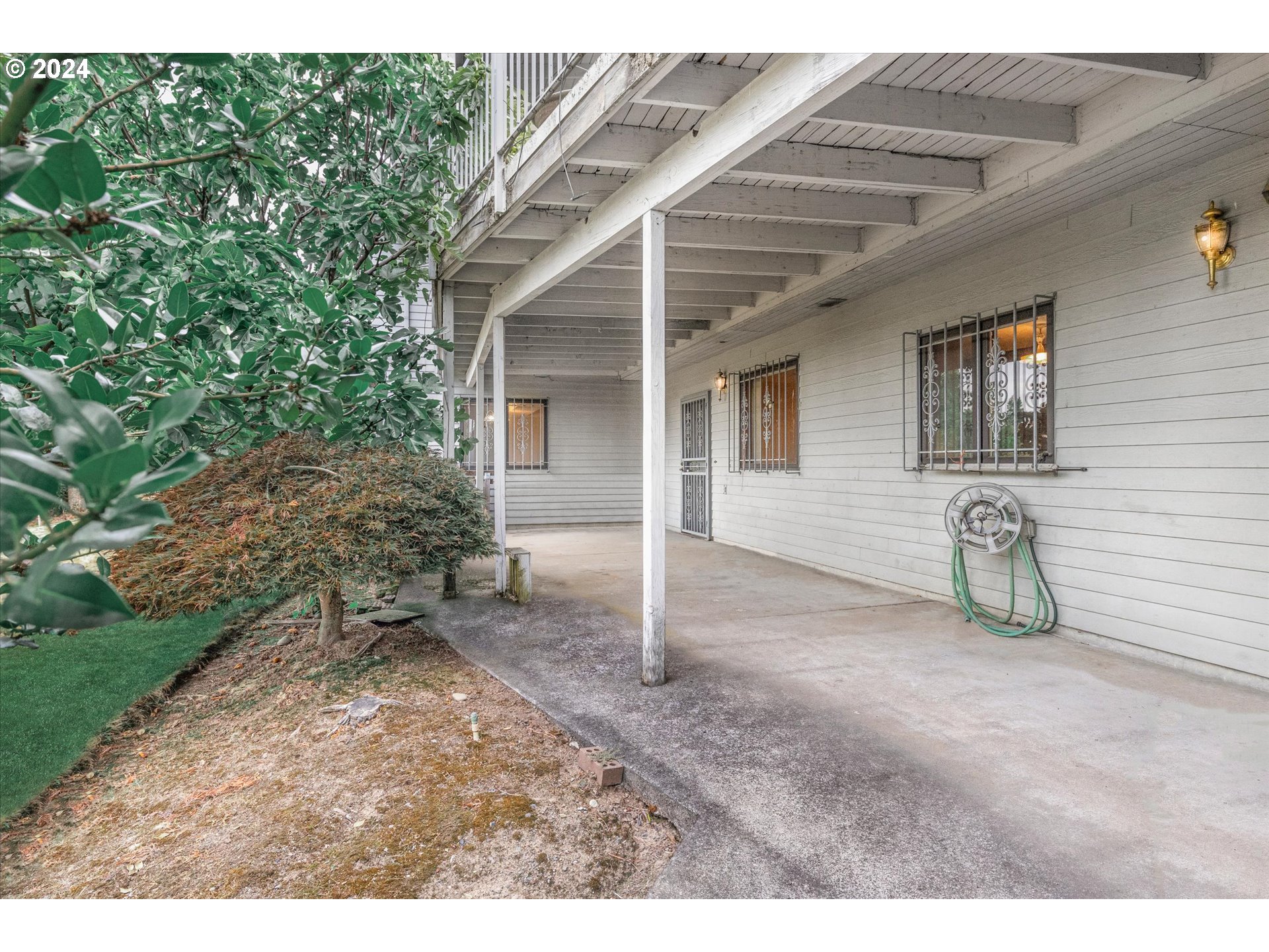 10755 Southeast 92nd Avenue Happy Valley, OR 97086 - Photo 29 of 40 a view of a house with a patio and garden
