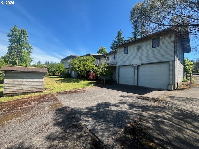 10755 Southeast 92nd Avenue Happy Valley, OR 97086 - Photo 3 of 40 a front view of a house with a yard and garage