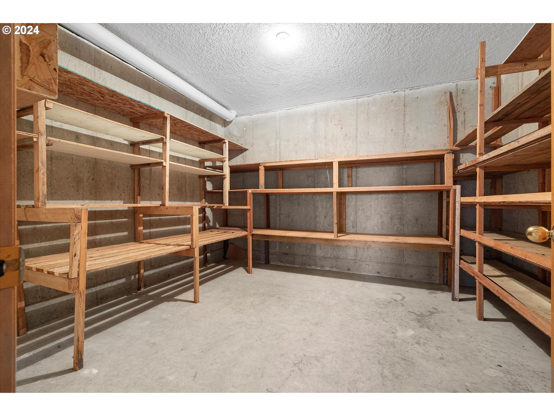 10755 Southeast 92nd Avenue Happy Valley, OR 97086 - Photo 33 of 40 a view of an empty room with wooden shelves