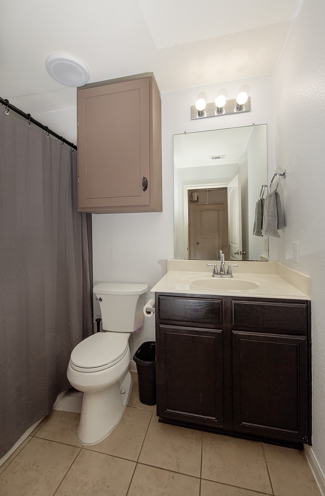 216 Millers Loop Jarrell, TX 76537 - Photo 17 of 31 Full bath with curtained shower, vanity, wall storage and tile flooring