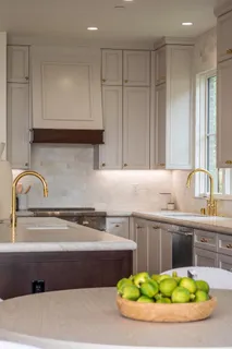 a kitchen with a sink and cabinets