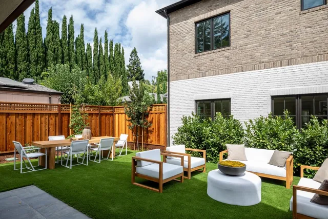 a outdoor space with a table and chairs
