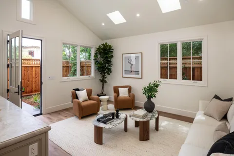 a living room with furniture and windows