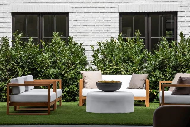 a couple of chairs in front of house