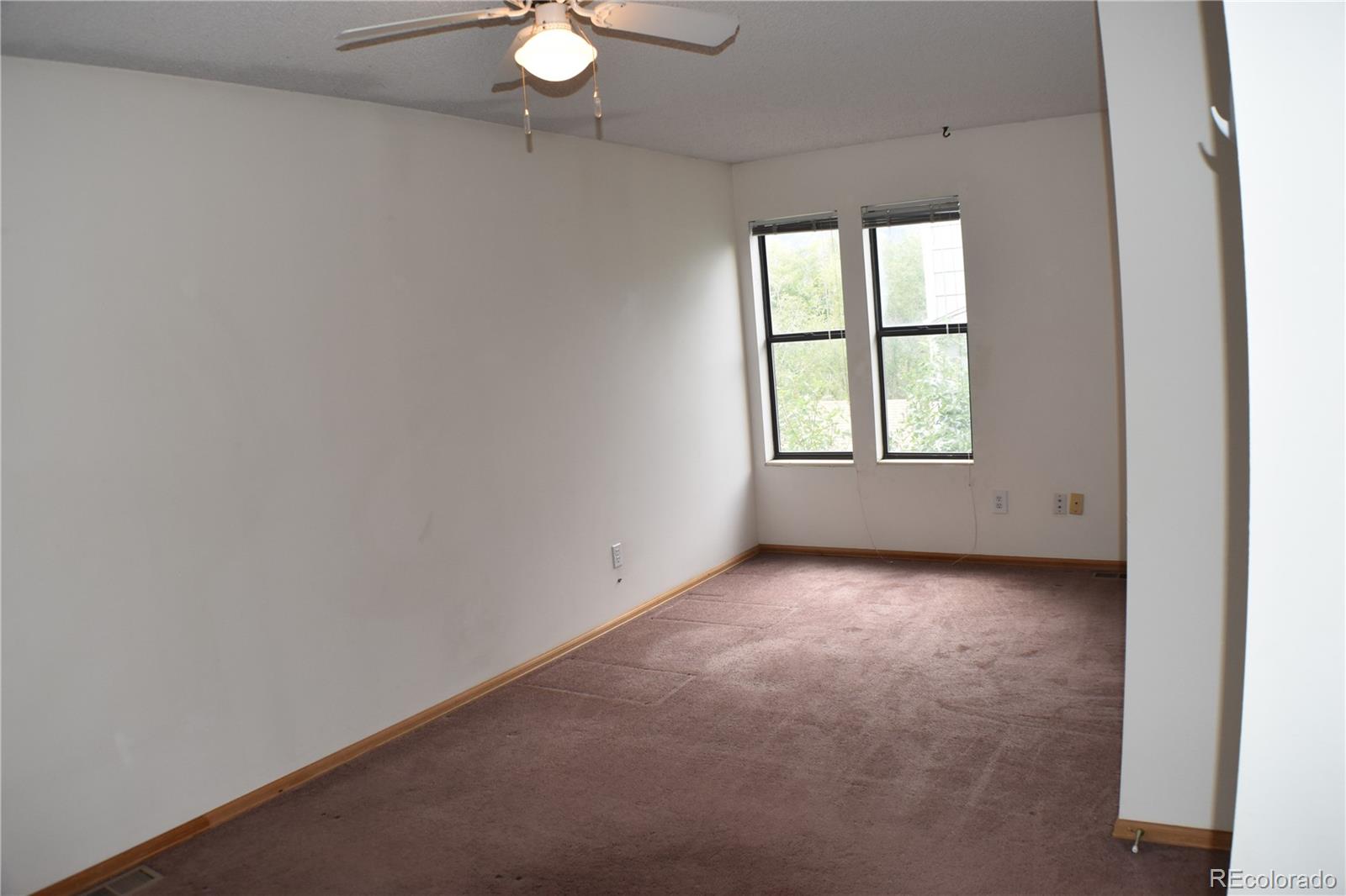 1322 Talley Circle Colorado Springs, CO 80904 - Photo 20 of 32 an empty room with a window