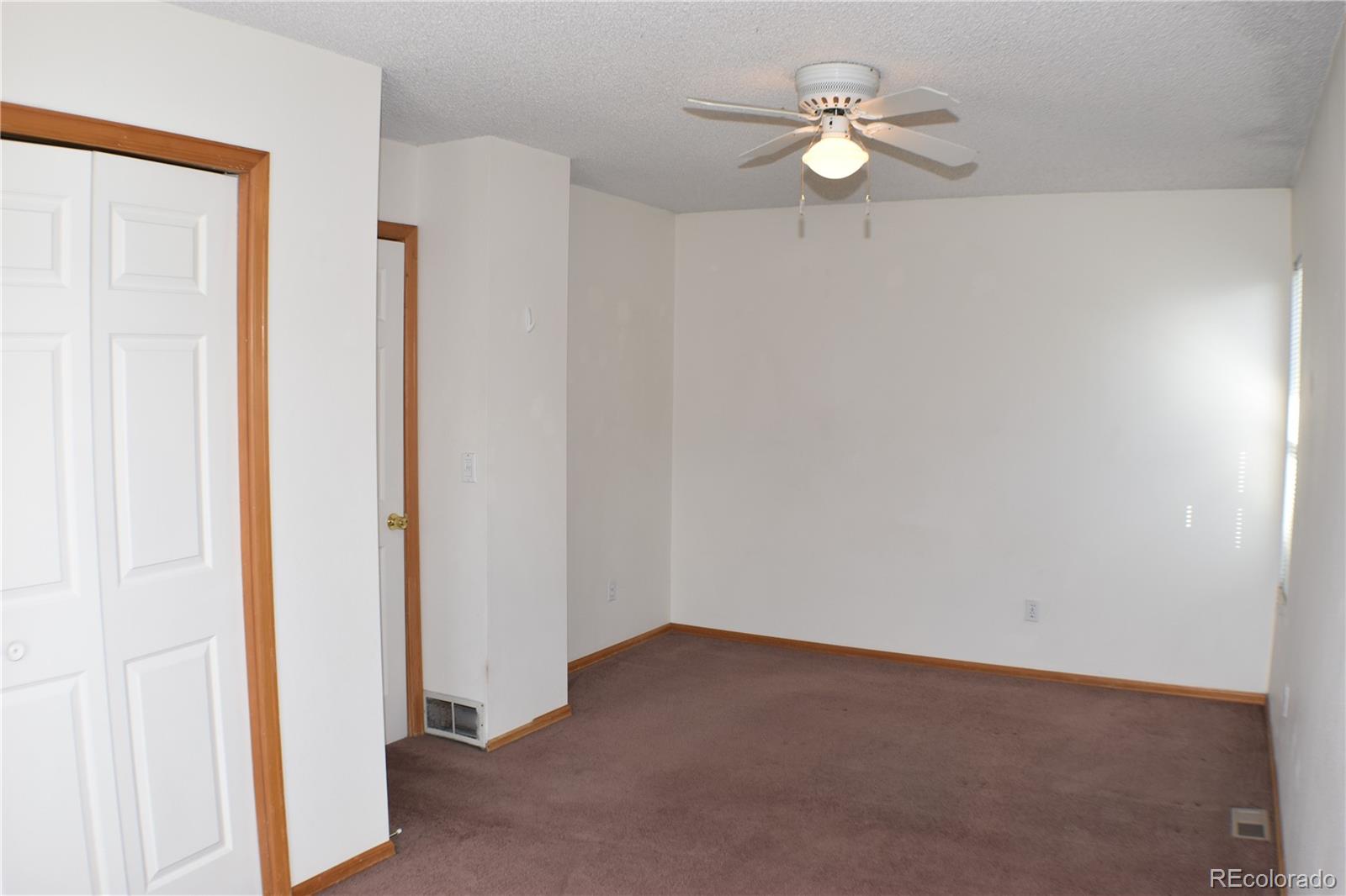 1322 Talley Circle Colorado Springs, CO 80904 - Photo 22 of 32 a view of a room with a fan and a fan
