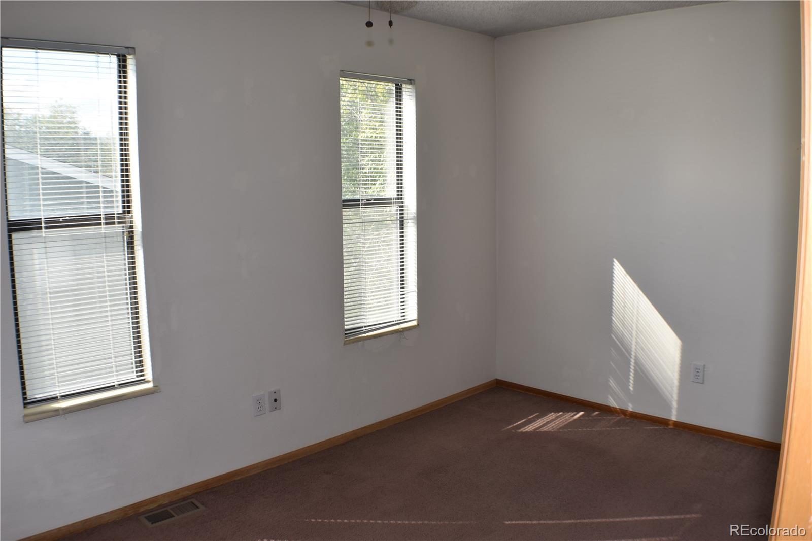1322 Talley Circle Colorado Springs, CO 80904 - Photo 23 of 32 an empty room with windows
