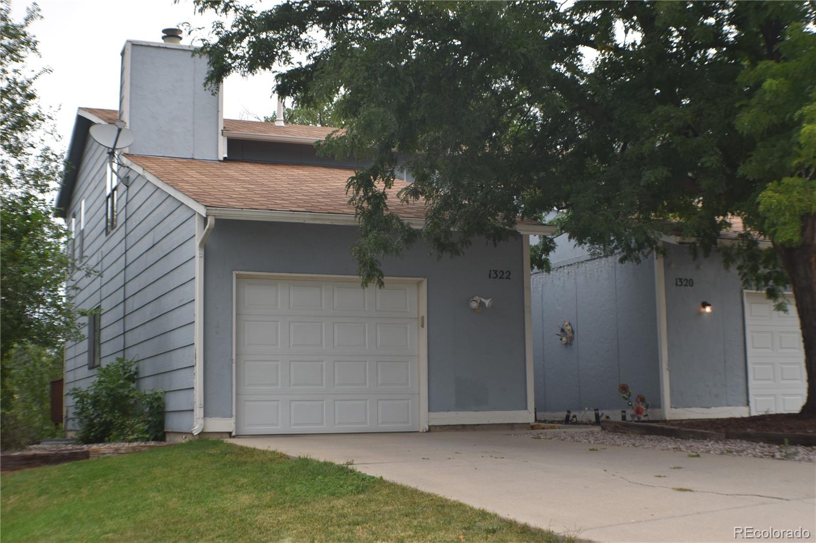 1322 Talley Circle Colorado Springs, CO 80904 - Photo 29 of 32 a house is sitting in middle of the green field