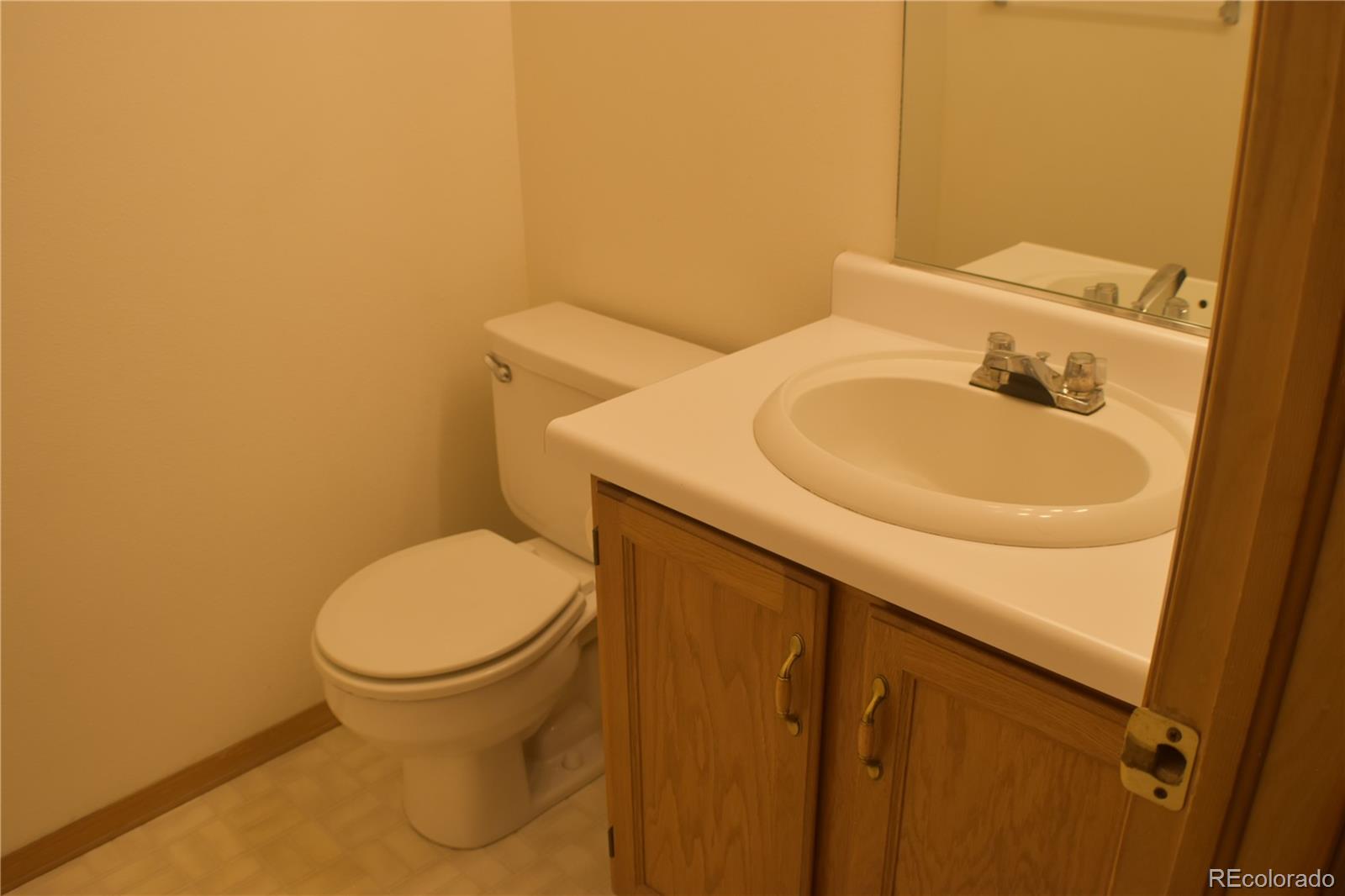 1322 Talley Circle Colorado Springs, CO 80904 - Photo 6 of 32 a bathroom with a sink and a toilet