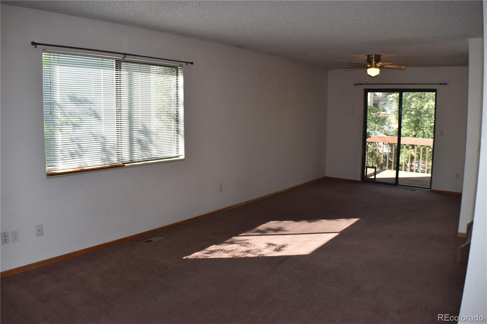 1322 Talley Circle Colorado Springs, CO 80904 - Photo 9 of 32 an empty room with a window