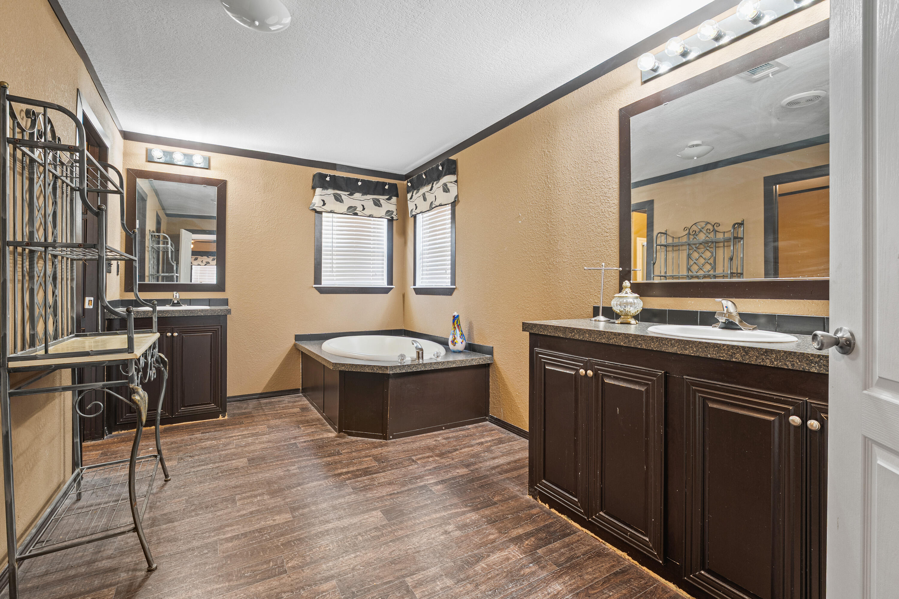 315 N Avenue North Post, TX 79356 - Photo 14 of 23 a spacious bathroom with a granite countertop tub sink and mirror