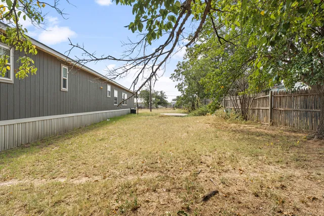 a view of backyard with green space