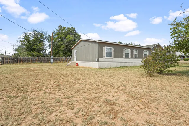 a house view with a backyard space