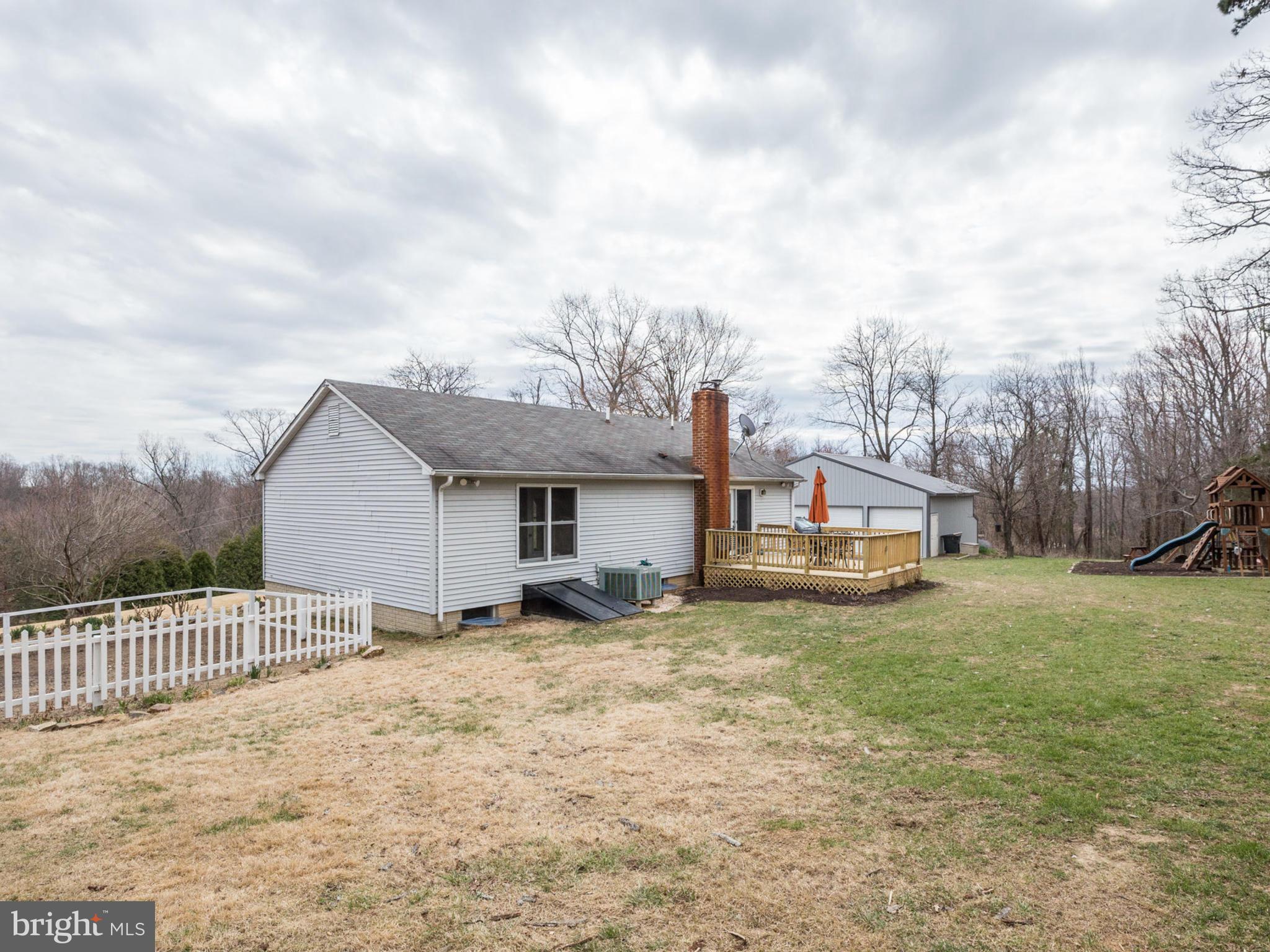 24075 New Mountain Road Aldie, VA 20105 - Photo 26 of 30 Large, flat backyard with fenced area for garden