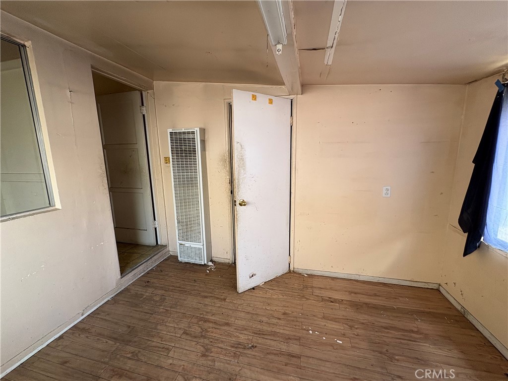 14023 Studebaker Road Norwalk, CA 90650 - Photo 18 of 33 a view of hallway with wooden floor