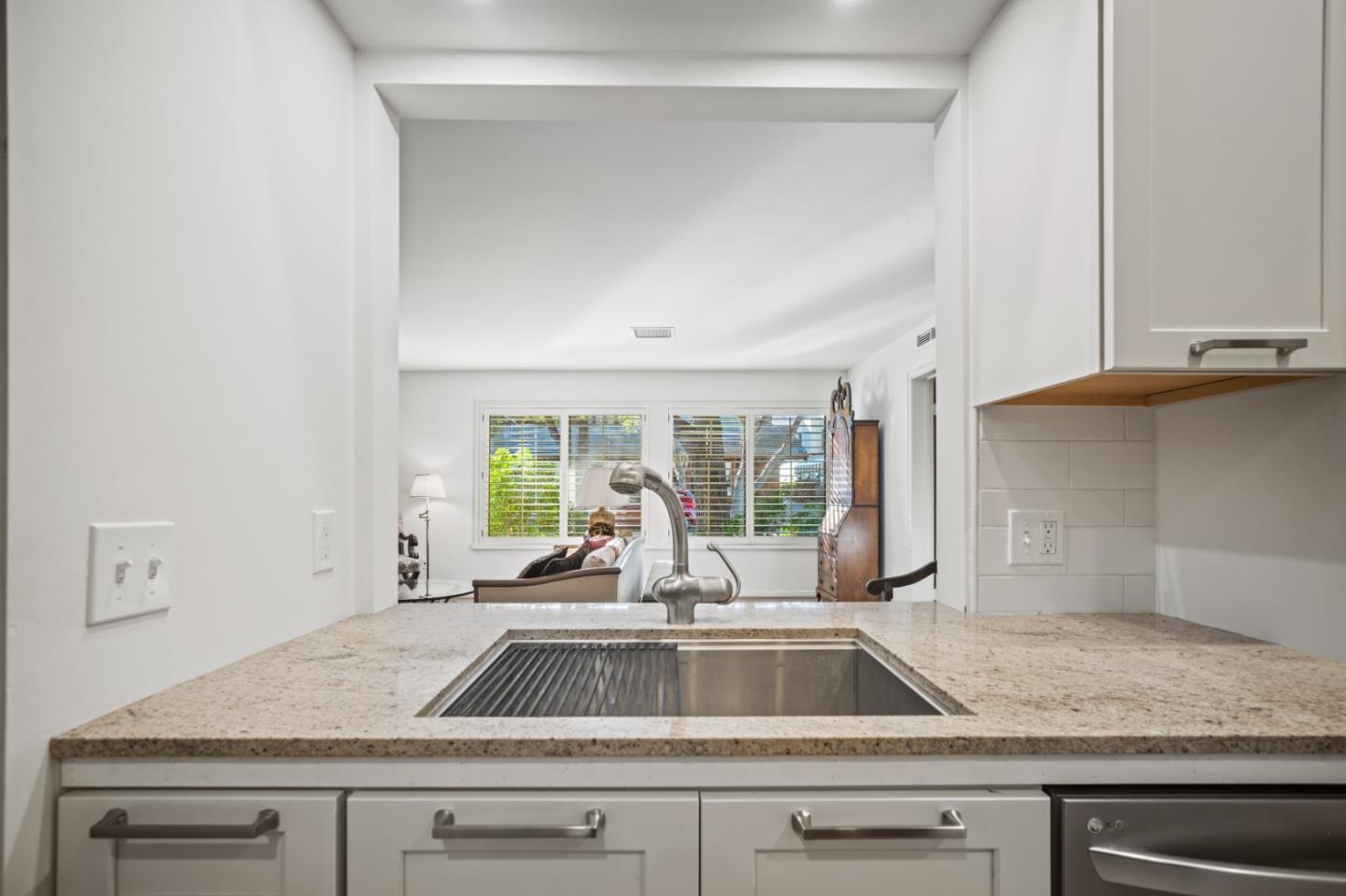 0 Northeast Ne Corner, Unit 1 Carmel, CA 93923 - Photo 15 of 33 a kitchen with a sink and a large window