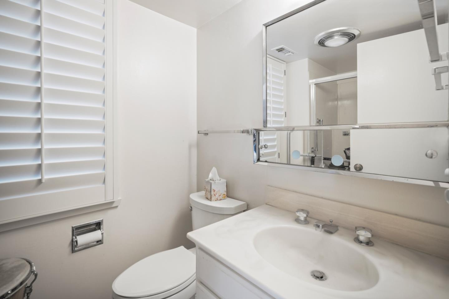 0 Northeast Ne Corner, Unit 1 Carmel, CA 93923 - Photo 23 of 33 a bathroom with a sink mirror and toilet