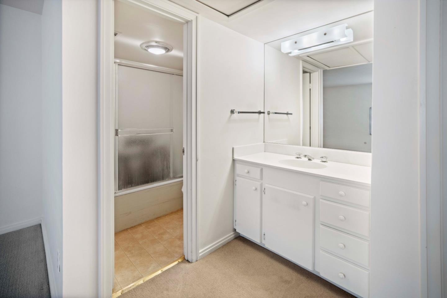 0 Northeast Ne Corner, Unit 1 Carmel, CA 93923 - Photo 25 of 33 a bathroom with a sink and a mirror