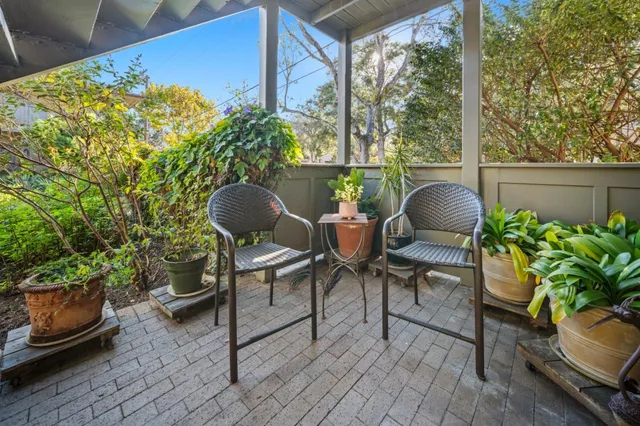 a outdoor living space with furniture and a potted plant